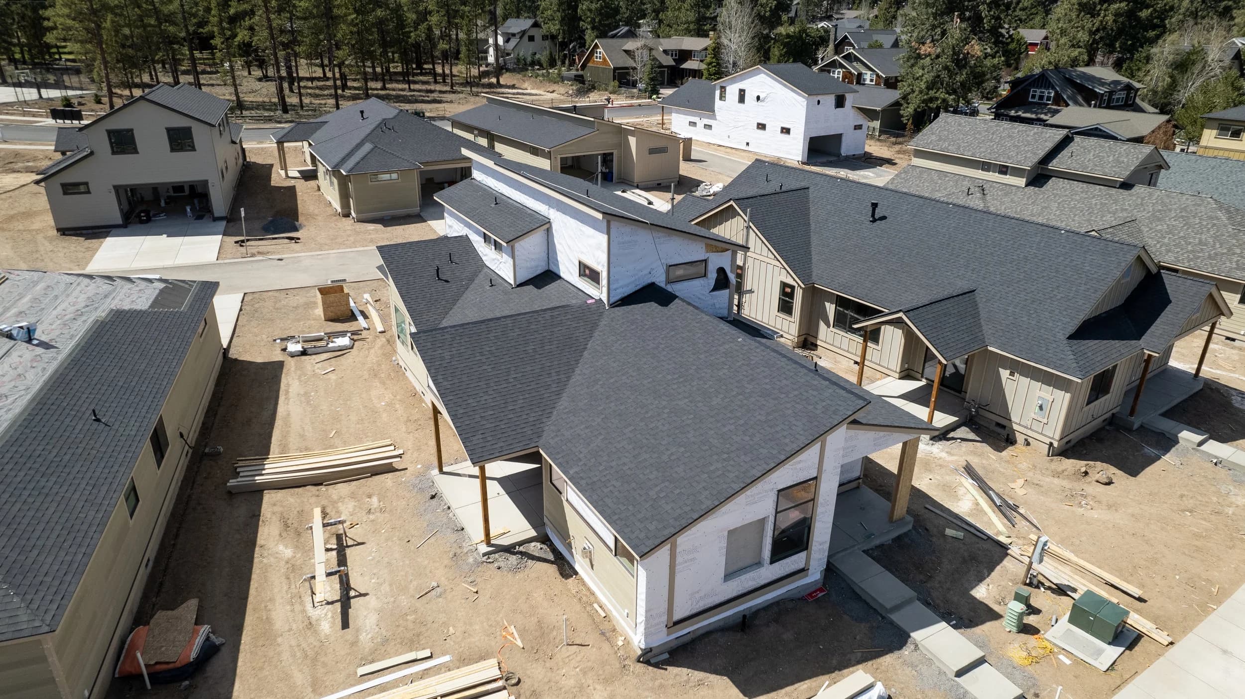 Aerial view of new Bend, Oregon homes with fresh Greenlee Roofing shingle roofs ready for solar